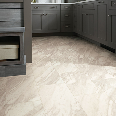 stone look large format luxury vinyl tile flooring in kitchen