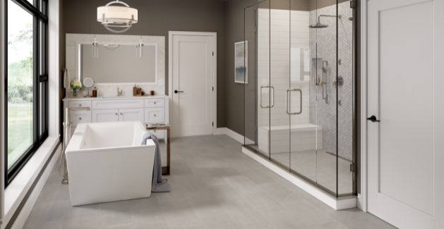 Ceramic floor tile in a stunning master bathroom with large shower and soaking tub